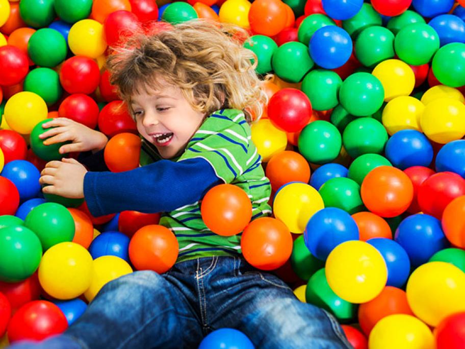 child in a ball pit