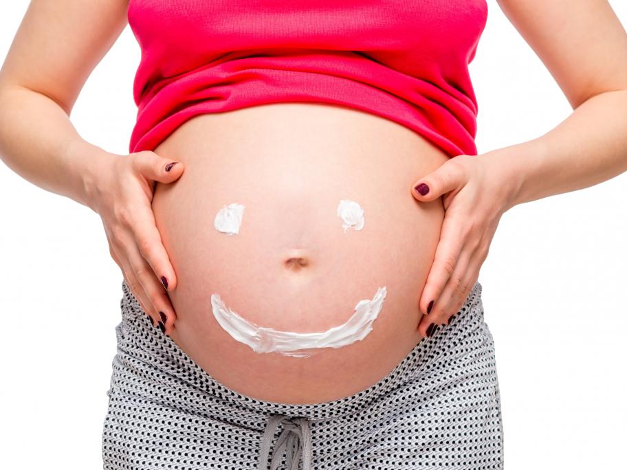 smiley face on pregnant stomach