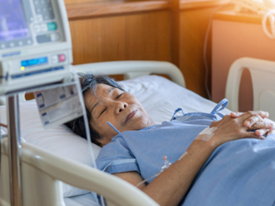 Chinese woman in hospital on a drip