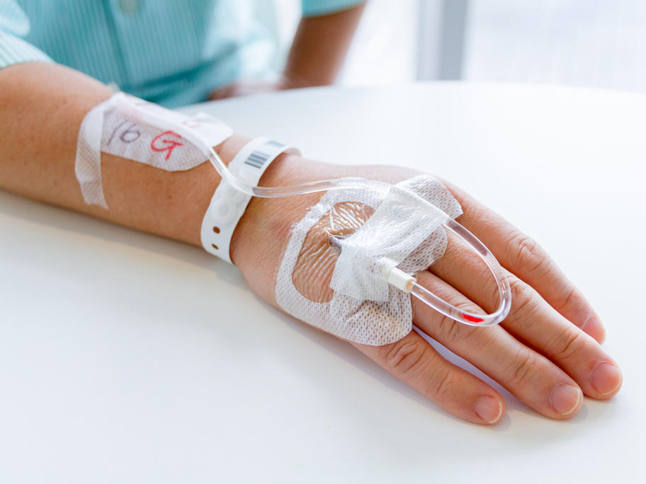 woman's hand. IV drip.