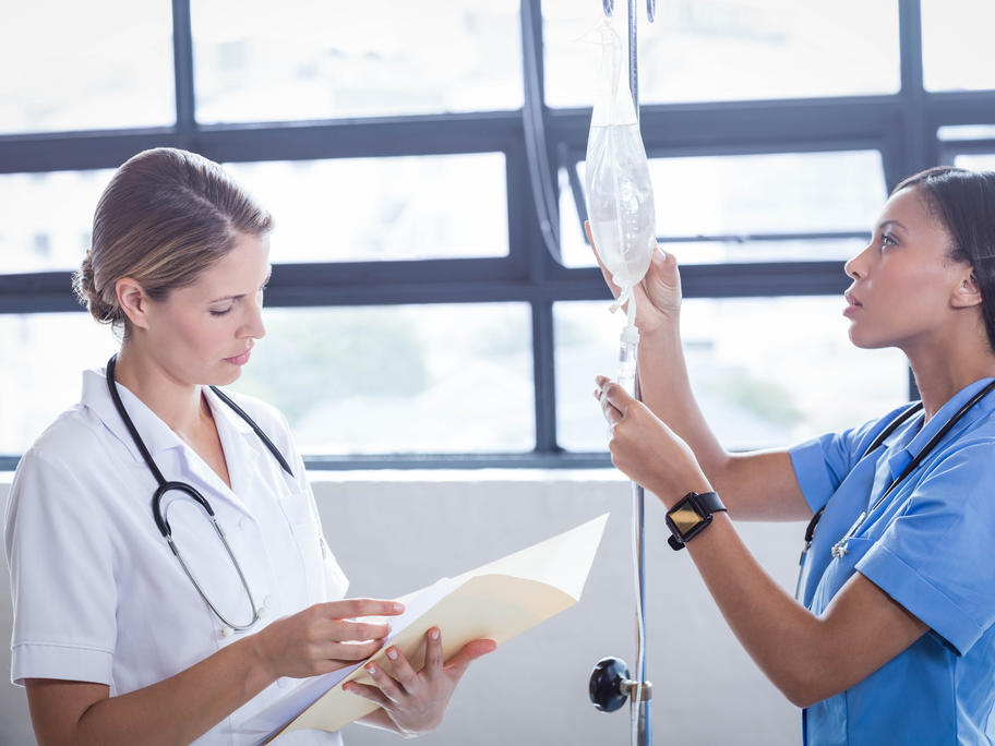 Nurse and doctor setting up IV