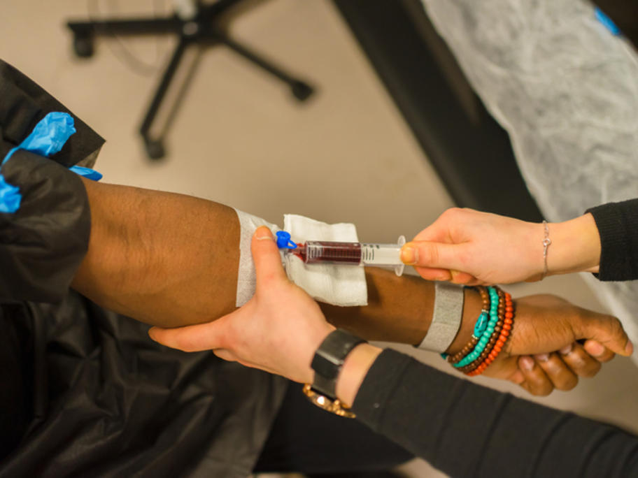 Indigenous women having blood taken