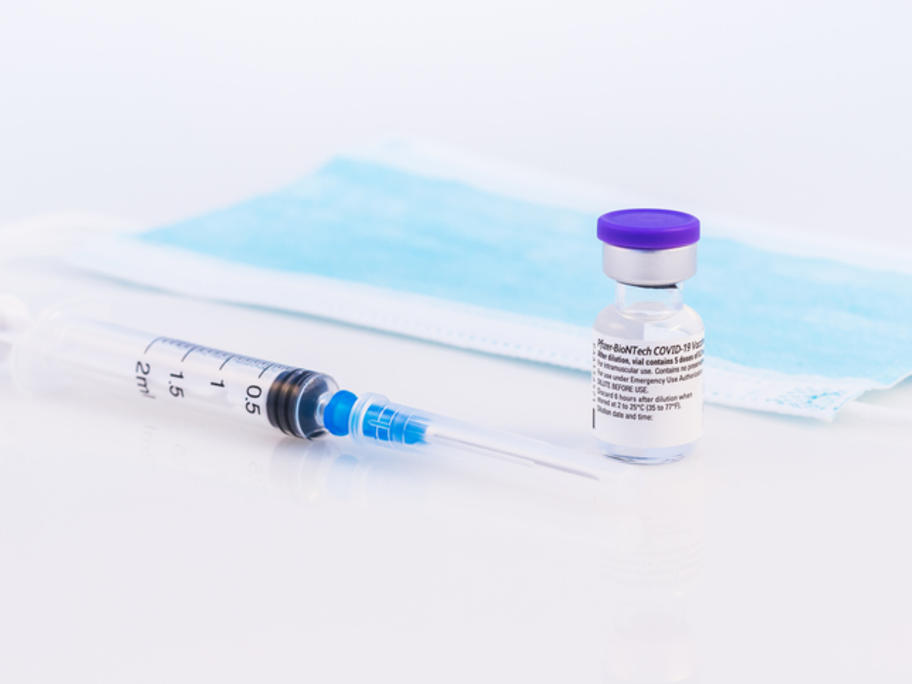 Pfizer vax, syringe and mask