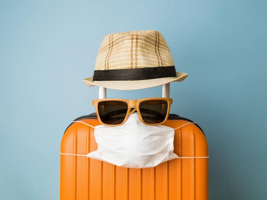 Suitcase with face mask