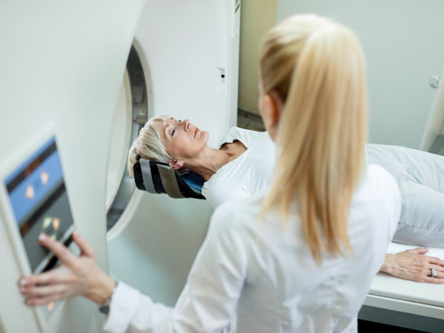 Woman going in to PET scanner