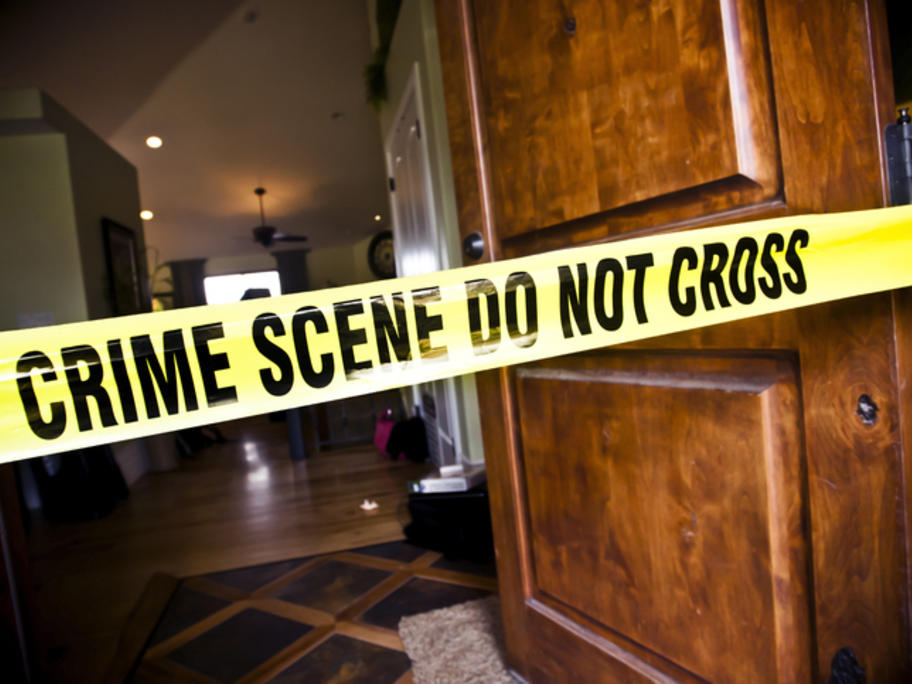 Police tape across crime scene