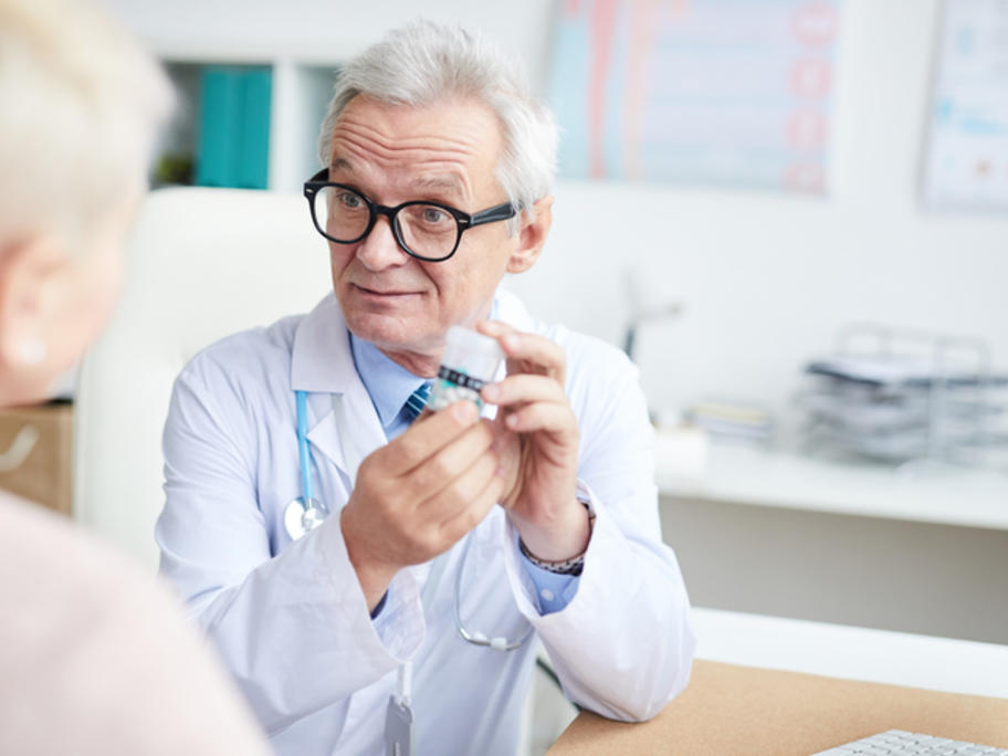 Hospital doctor prescribing pills