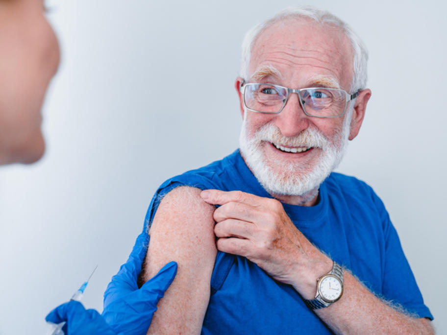 elderly man having coronavirus vax
