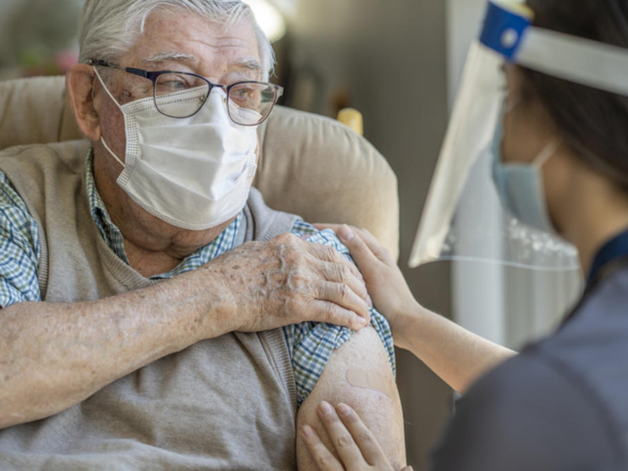 Elderly person receiving vaccine