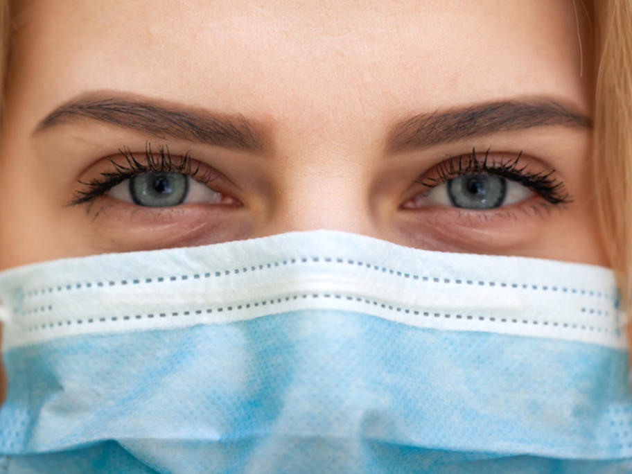 close up of young woman with face mask