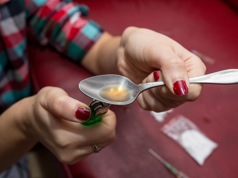 Preparing to inject heroin