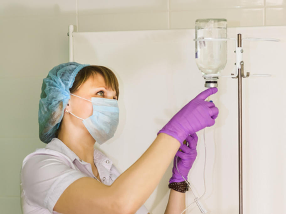 Nurtse preparing IV infusion