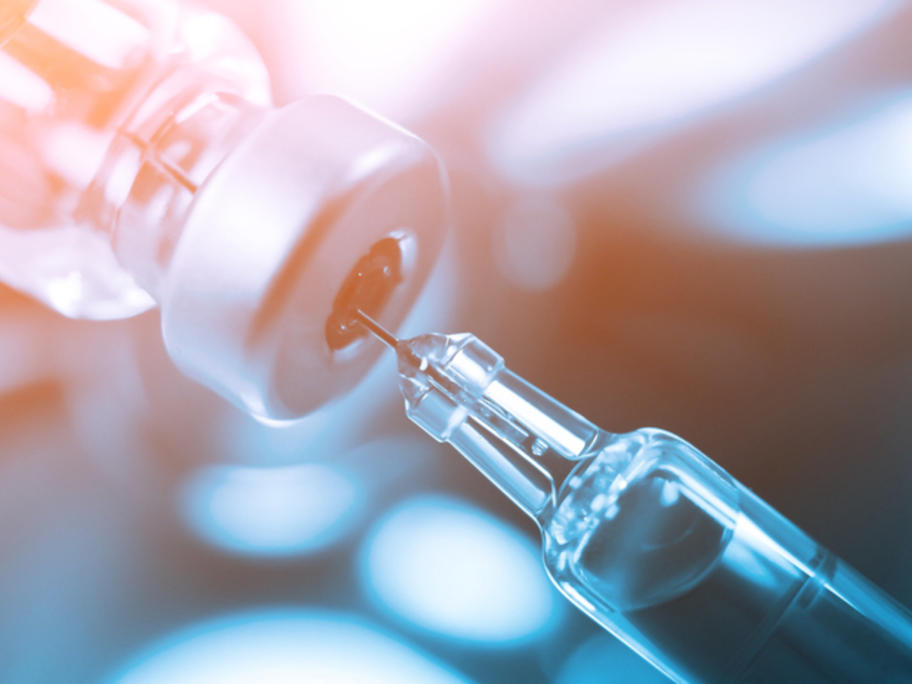 filling a syringe from a vial