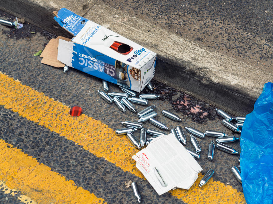 Nitrous oxide cannisters nangs discarded on the street