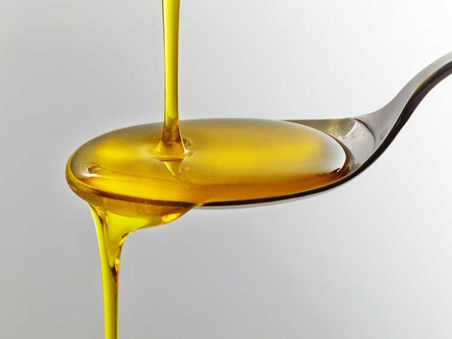 olive oil on a spoon