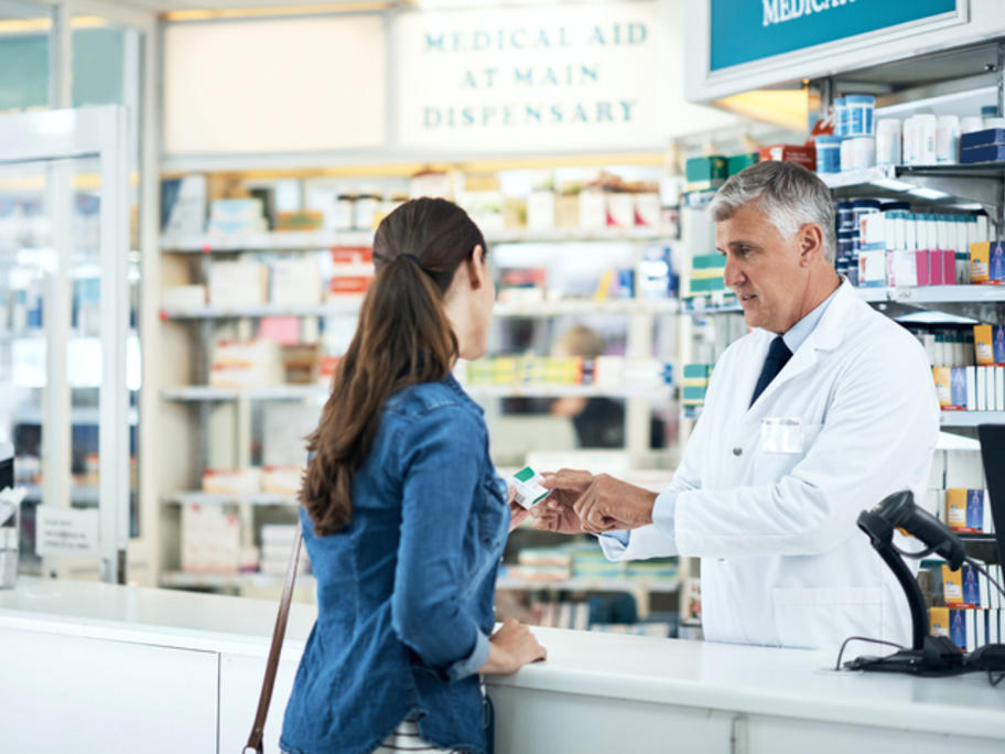 Pharmacist and young woman patient