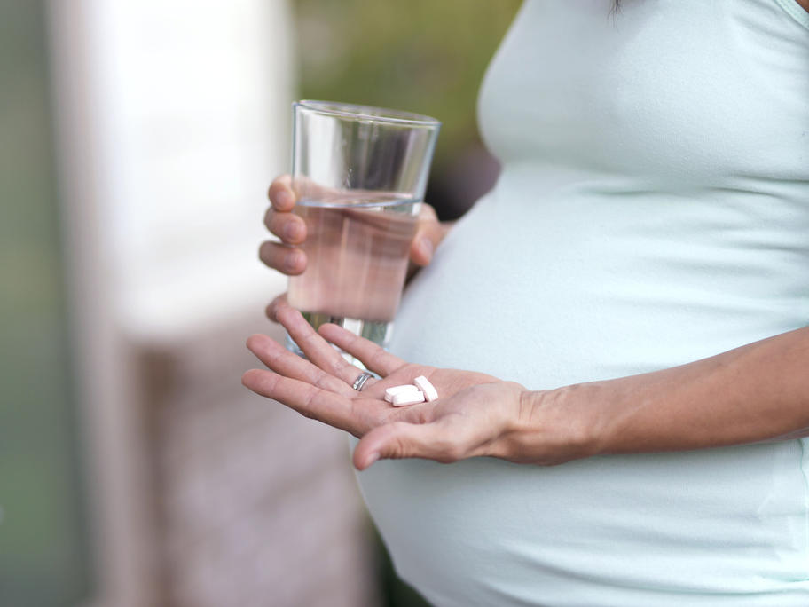 Pregnant woman with pills