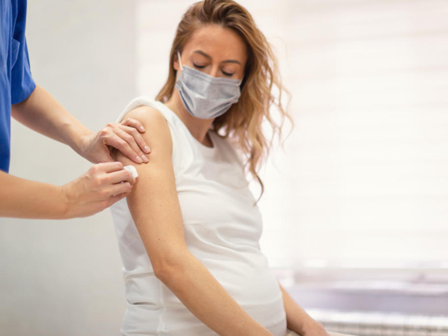Pregnant woman getting vaccine