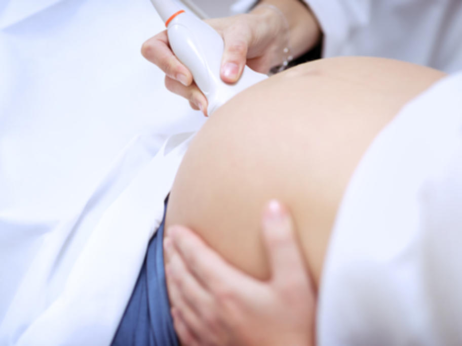 woman in third trimester having ultrasound