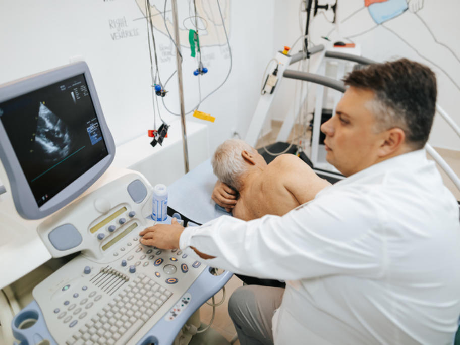 Senior man having echocardography