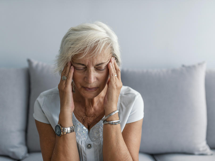 senior woman with migraine 