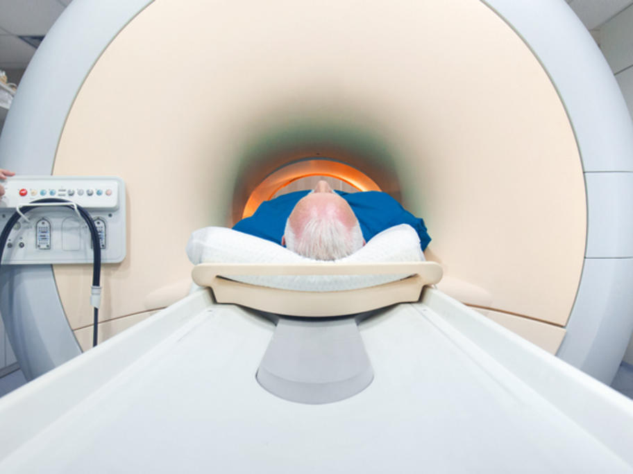 senior man going into mRI machine