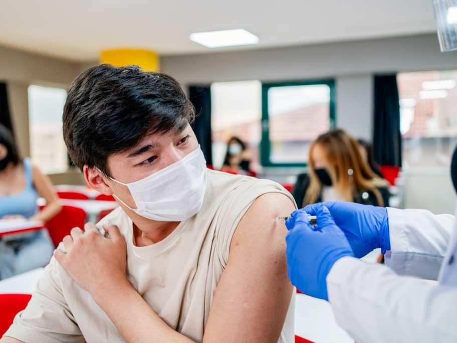 Teen getting vaccine