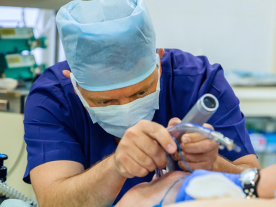 anaesthetist peforming tracheal intubation