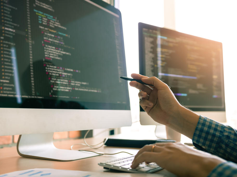 person writing computer code