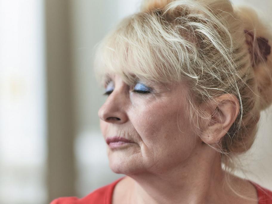 Mature woman eyes closed