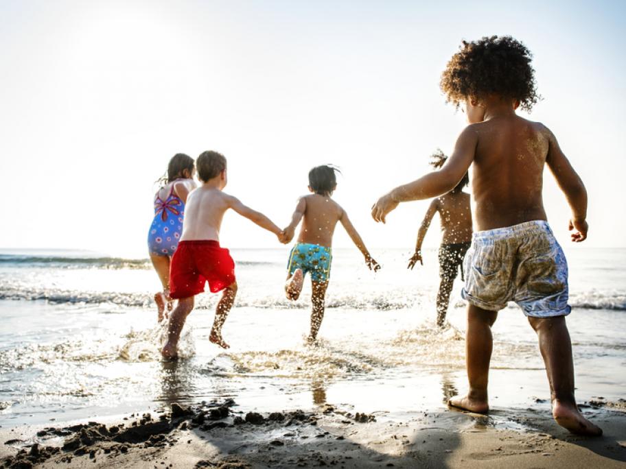 Yound children playing on the beach