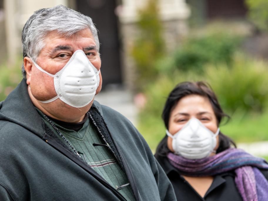 Obese man and woman wearing face masks