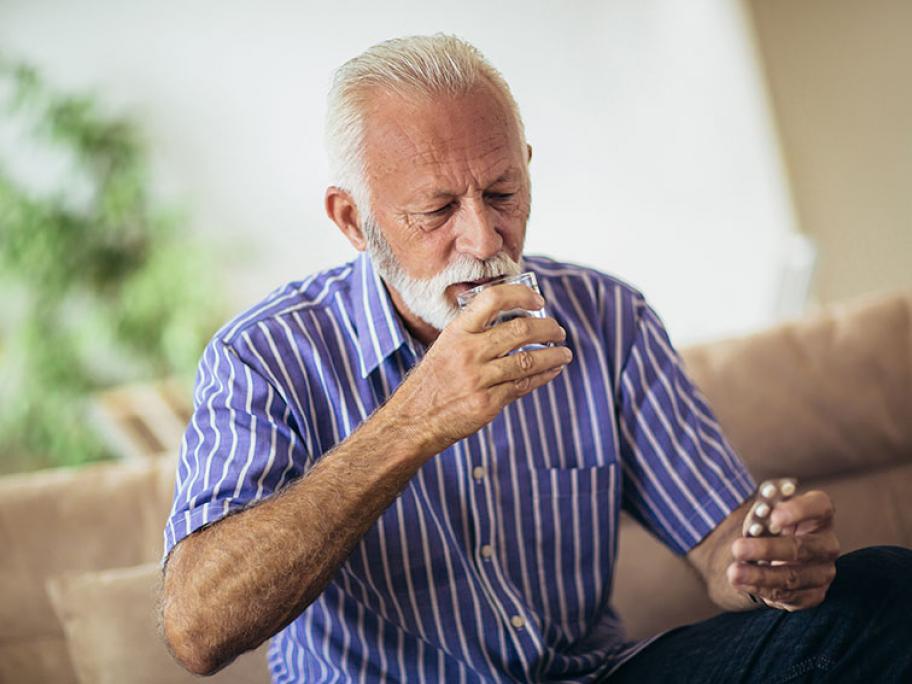 Senior taking pills