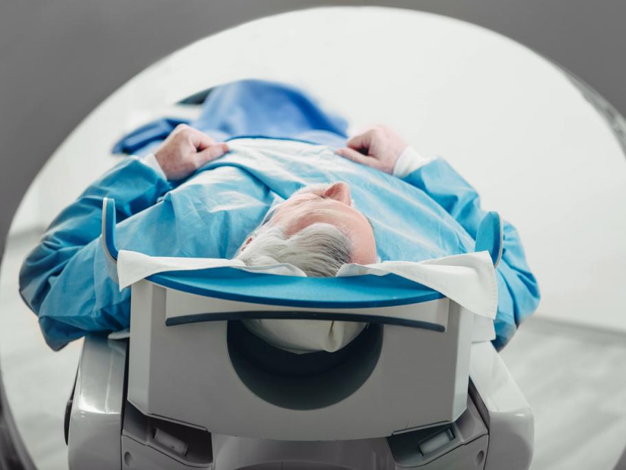 senior man entering a CT scanner