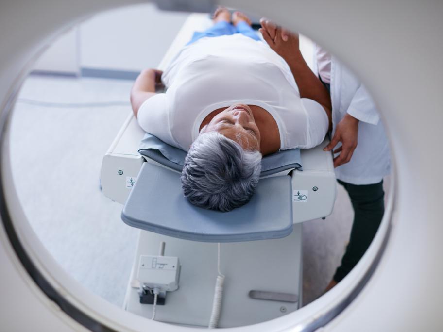 Senior woman going into CT scanner