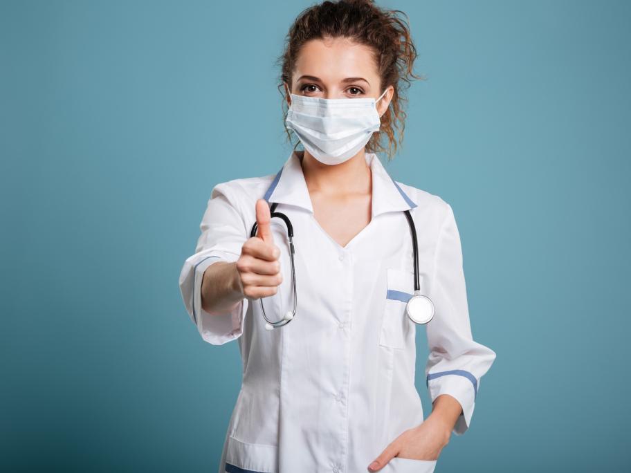 doctor in mask with thumbs up