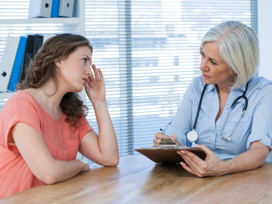 Doctor with doubtful-looking patient