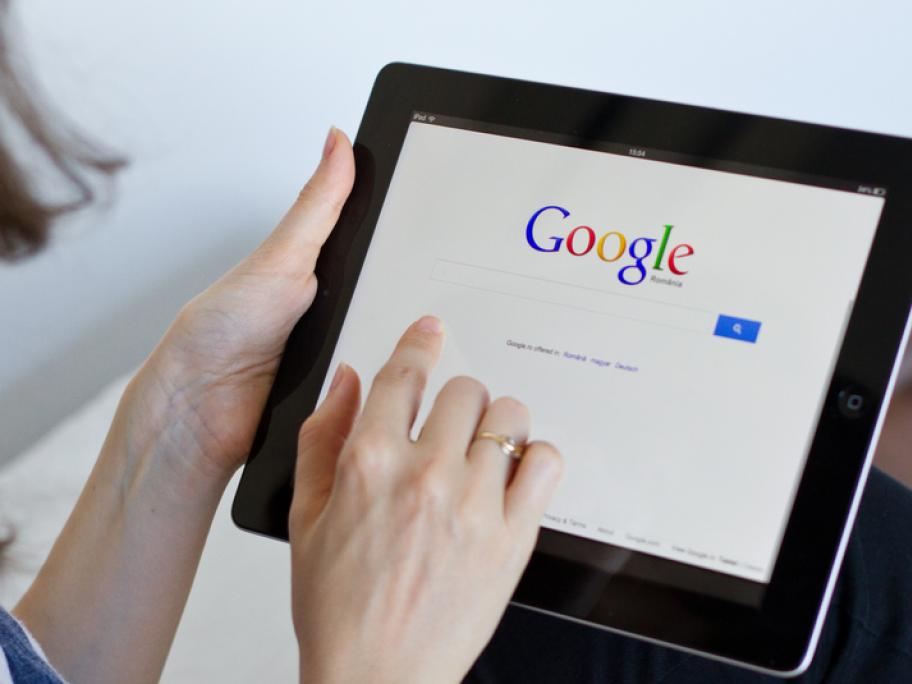 woman doing google search on her tablet