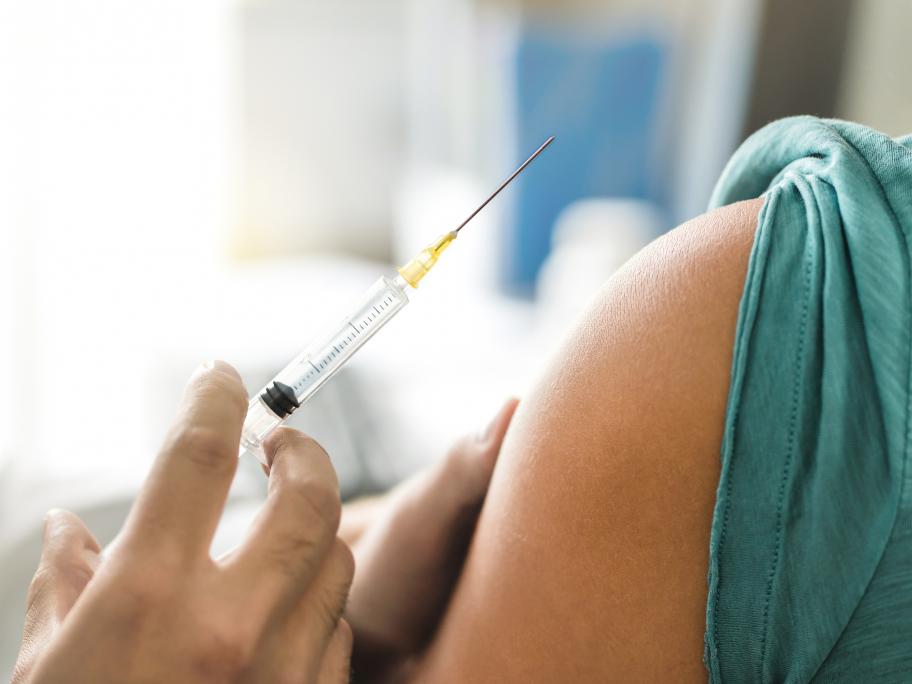 Young woman having injection