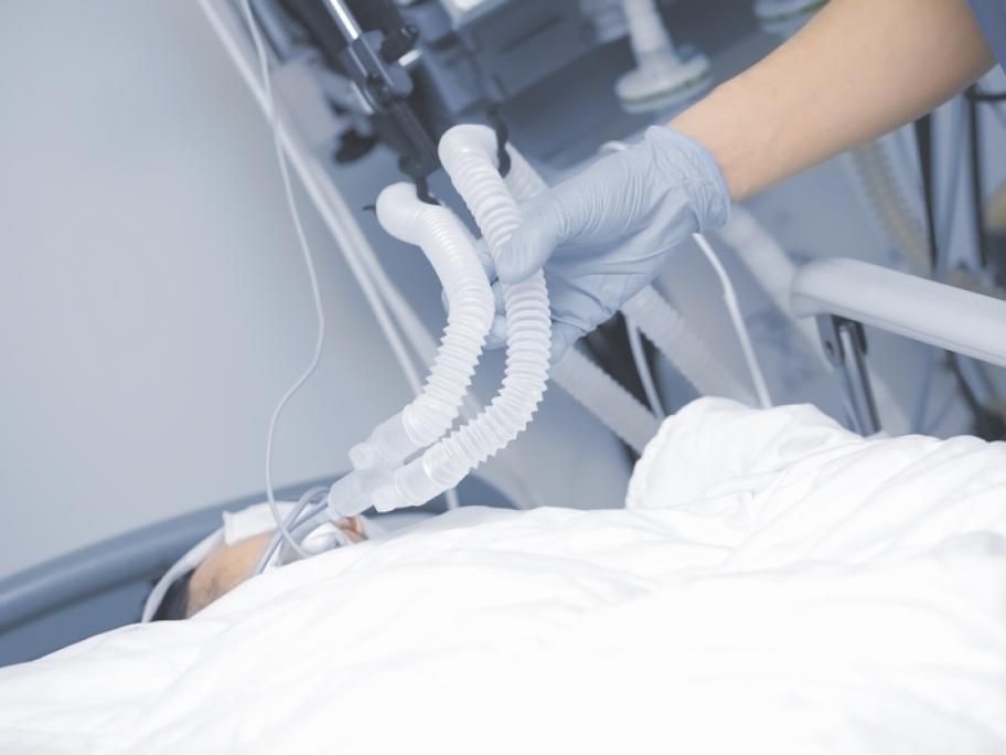 Person in ICU on ventilator