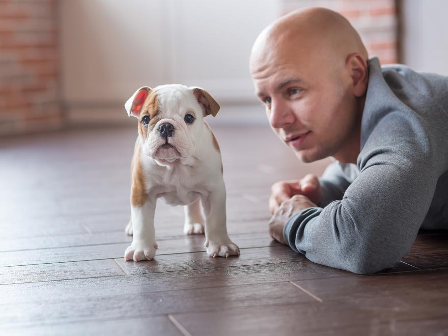 man with puppy