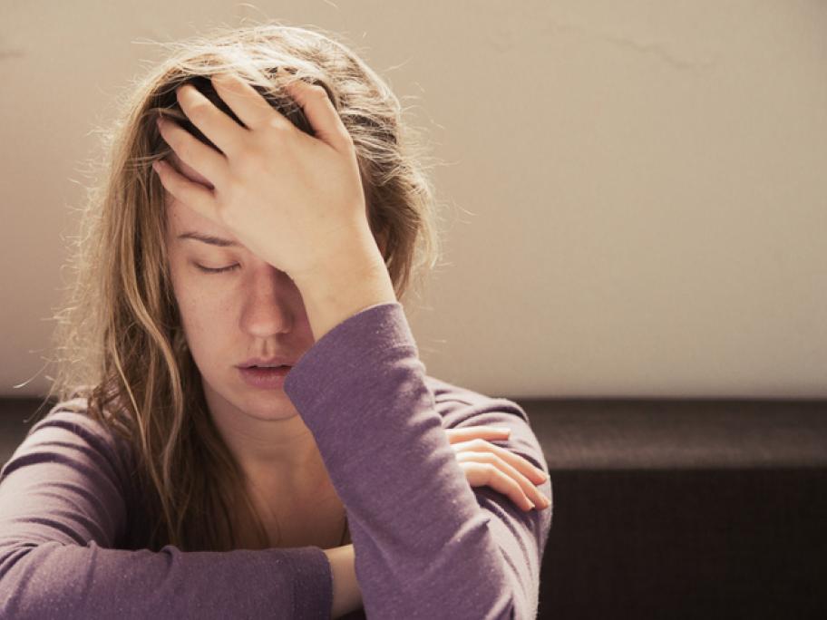 Young woman with migraine