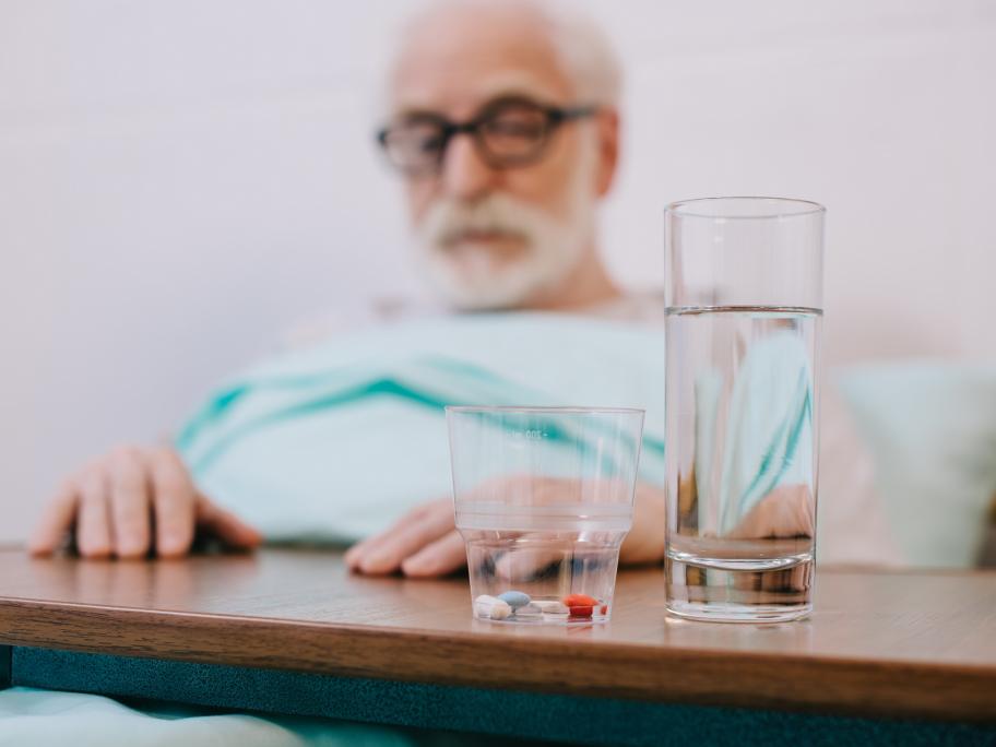 old man with pills