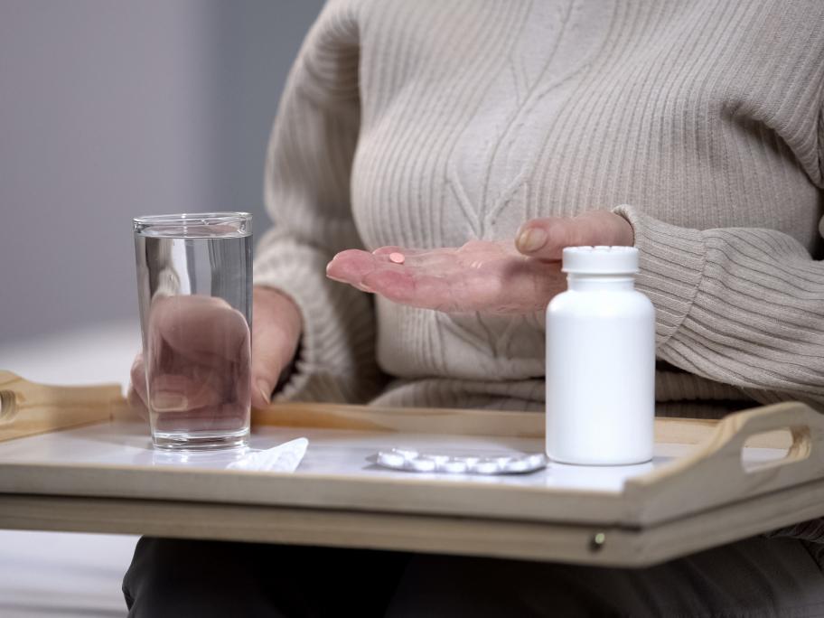 old woman with pills