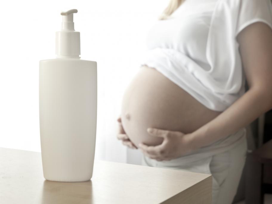 Pregnant woman using cream