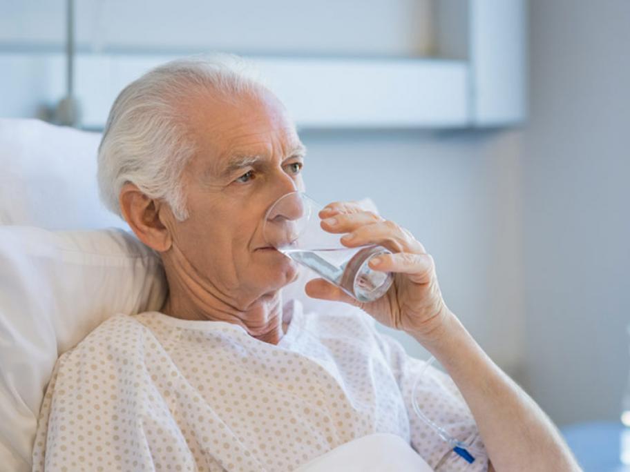 man in hospital bed