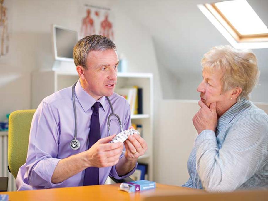 doctor talking to senior patient