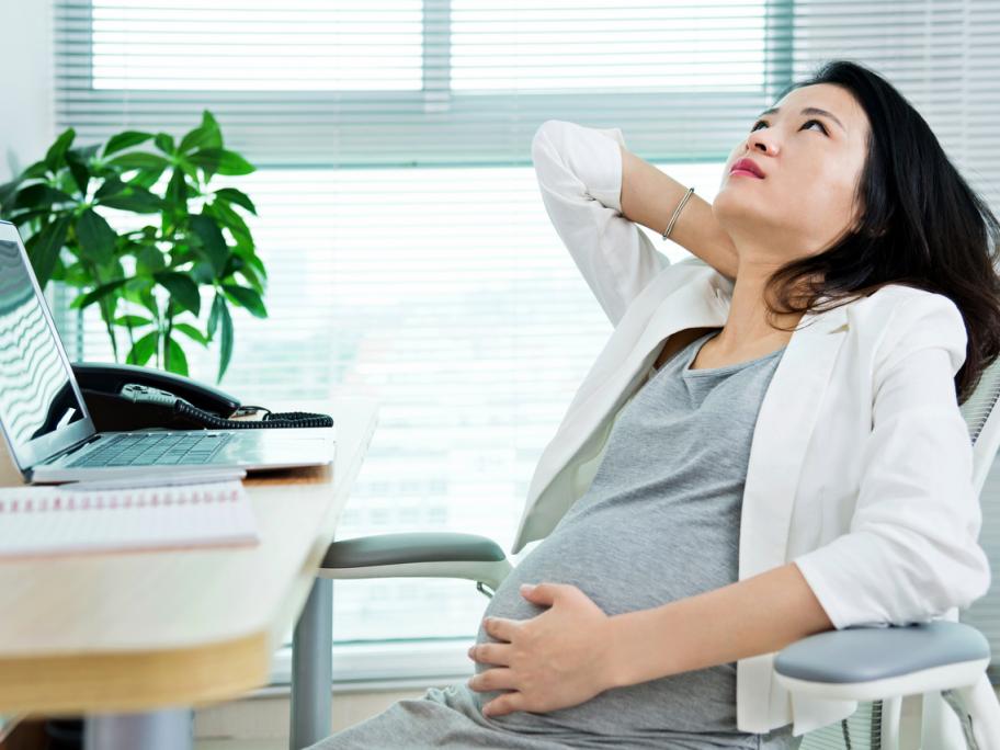 Stressed-looking pregnant woman