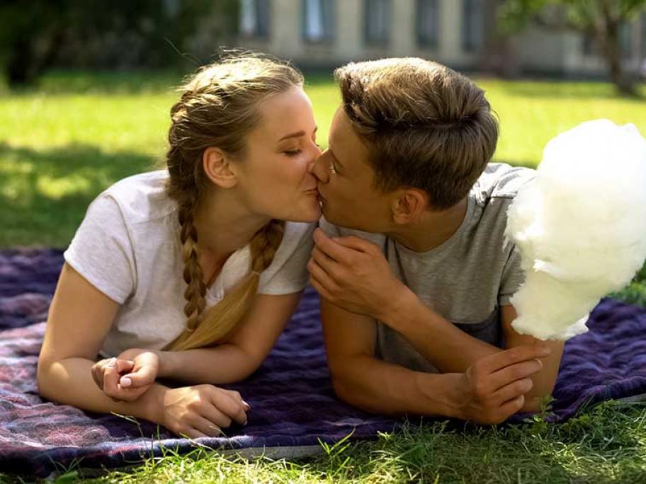 Teenagers kissing
