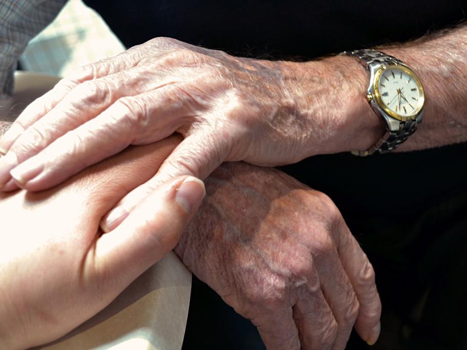Holding patient's hand